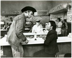 Macadam Cowboy : Jon Voight et Dustin Hoffman en face-à-face - Tirage argentique d'époque, 1969 - Photo Memory